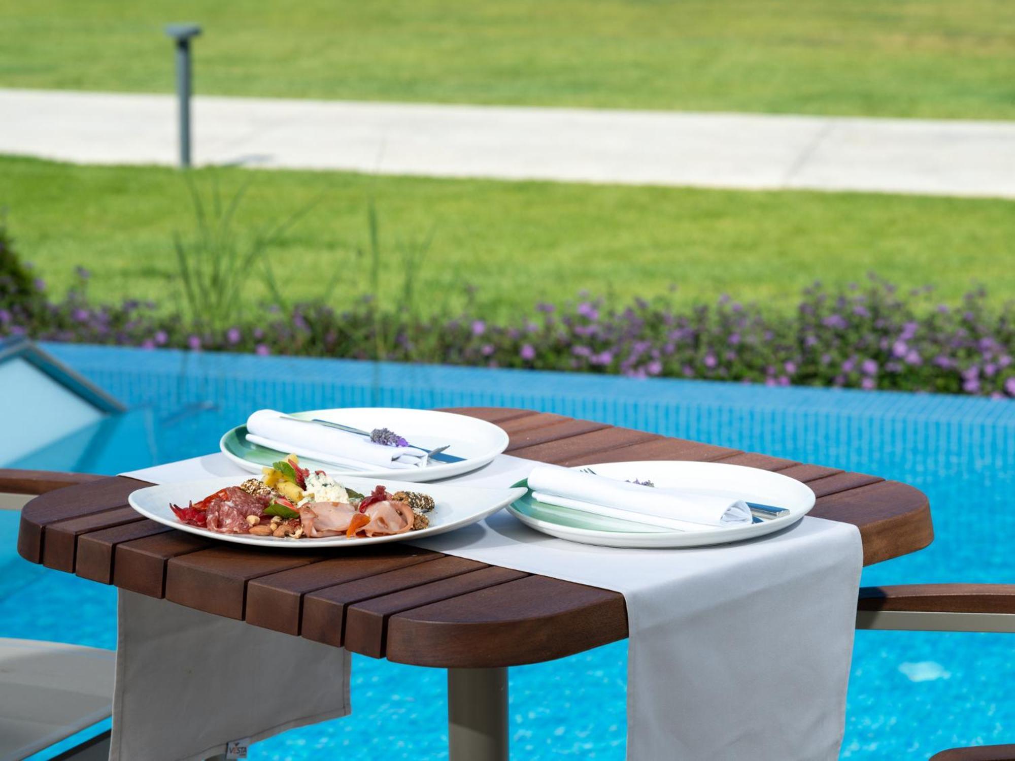 Ammoa Luxury Hotel & Spa Resort Nikiti  Exterior foto A table with a table runner